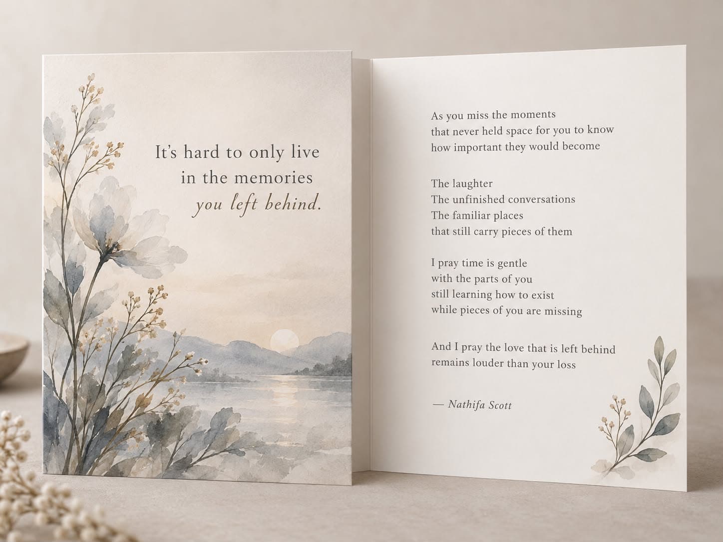 Soft blue-grey watercolor card of wildflowers and a lake at dusk, shown open beside its inside poem.